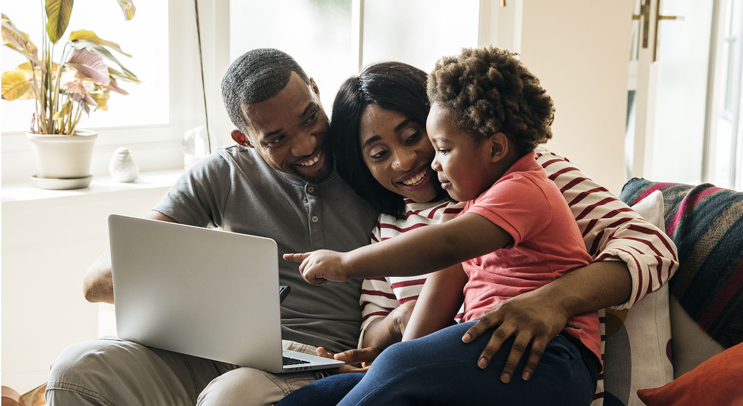 Photo of African family of 3 smiling