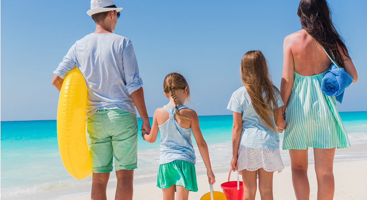 Family of 4 at beach